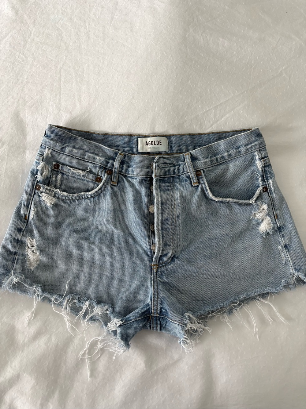 Agolde Faded Light Blue Distressed Denim Cutoff Shorts